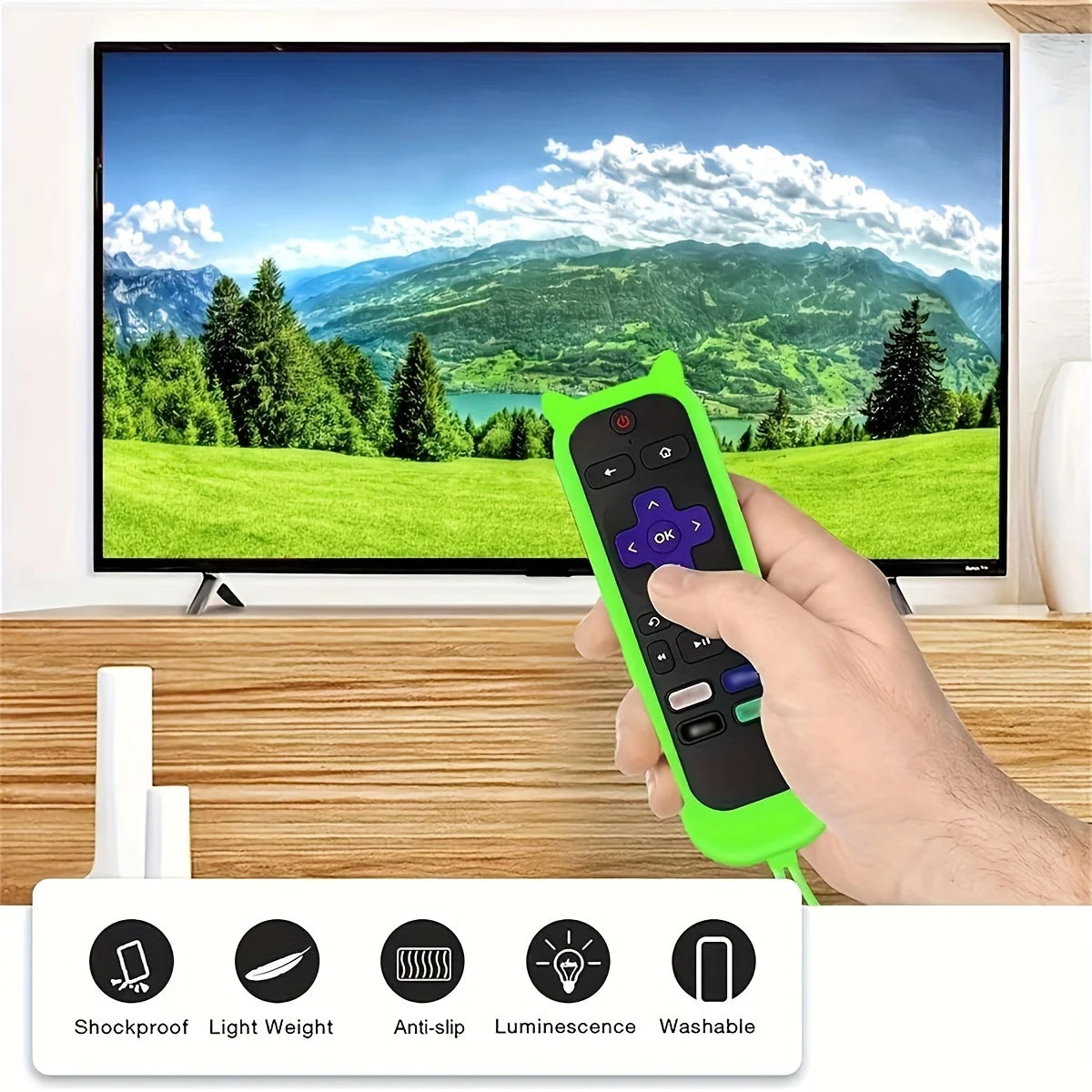 A hand holds a bright green glow-in-the-dark remote cover for Roku TV next to a large television screen.