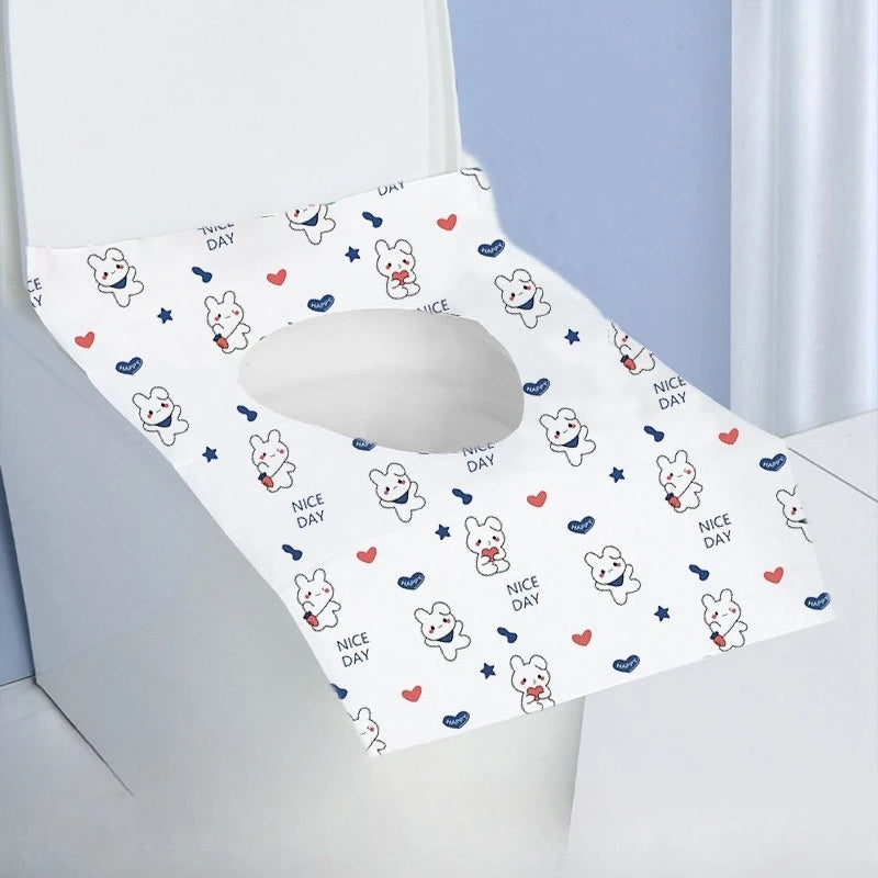 A white disposable printing seat cover featuring cute rabbit graphics and Nice Day text.