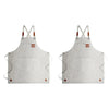 A light gray oil-proof canvas apron with utility pockets and adjustable straps.