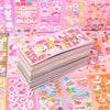 A stack of pink and colorful kawaii DIY stickers for crafting and decoration