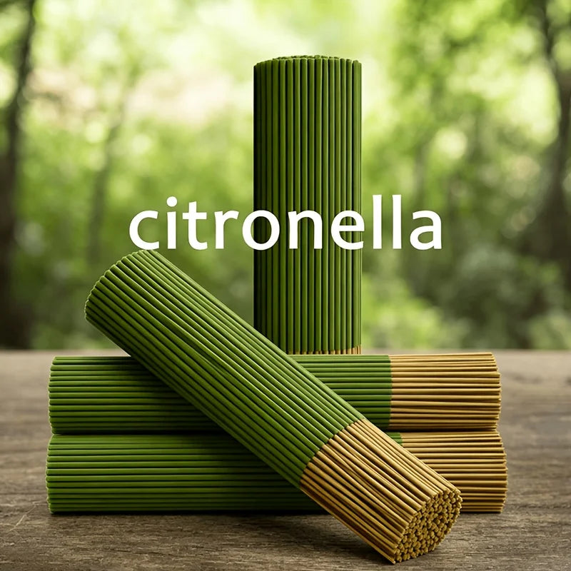 A stack of green citronella oil sticks, some lying horizontally on a wooden surface.