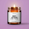 A glass jar candle with a lit wick, set against a light purple background.