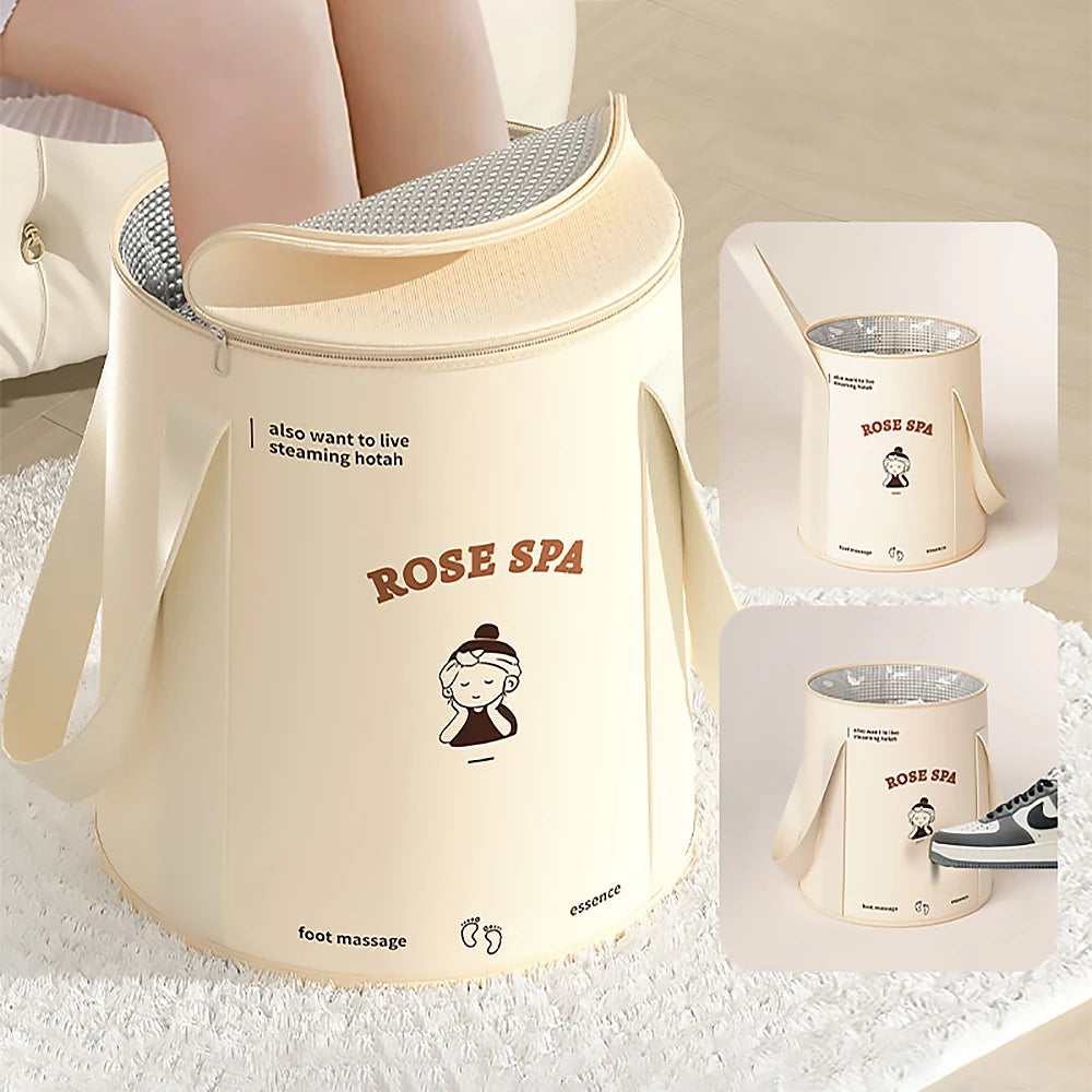 A beige foldable aluminum foot bath bucket with a perforated lid and a rose spa insert is shown on a white towel.