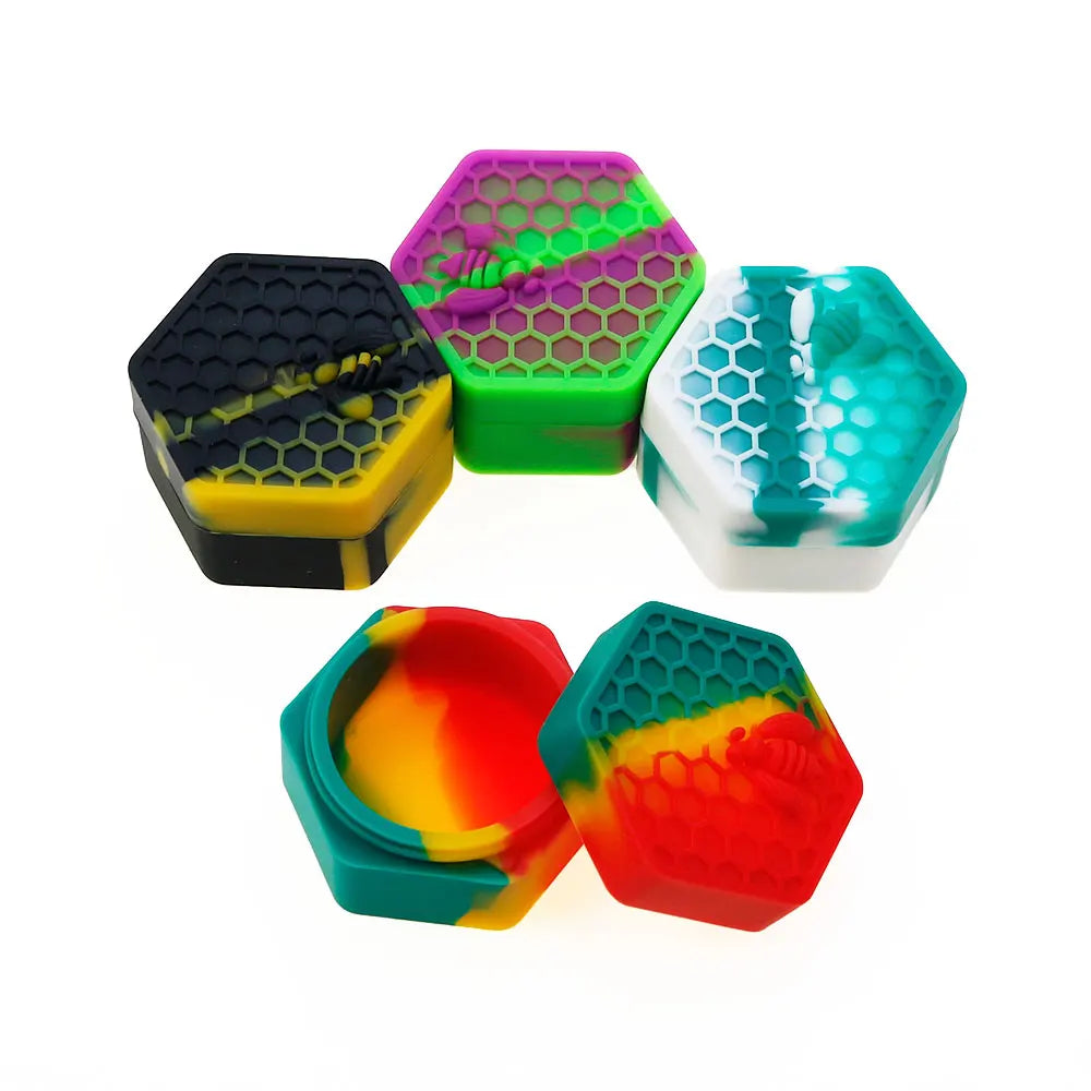 A collection of colorful hexagonal silicone storage jars in various shades including purple, green, black, and orange.