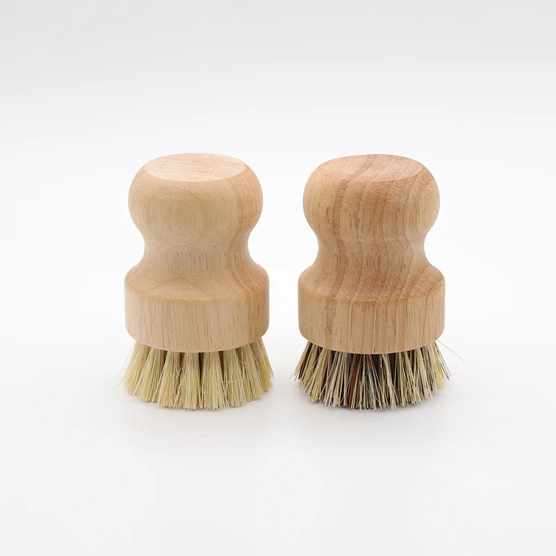 A set of two bamboo dish scrub brushes with sisal bristles, showing the wooden handles and natural fibers.