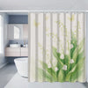 A shower curtain featuring a watercolor floral pattern of white and light green flowers on a pale background.