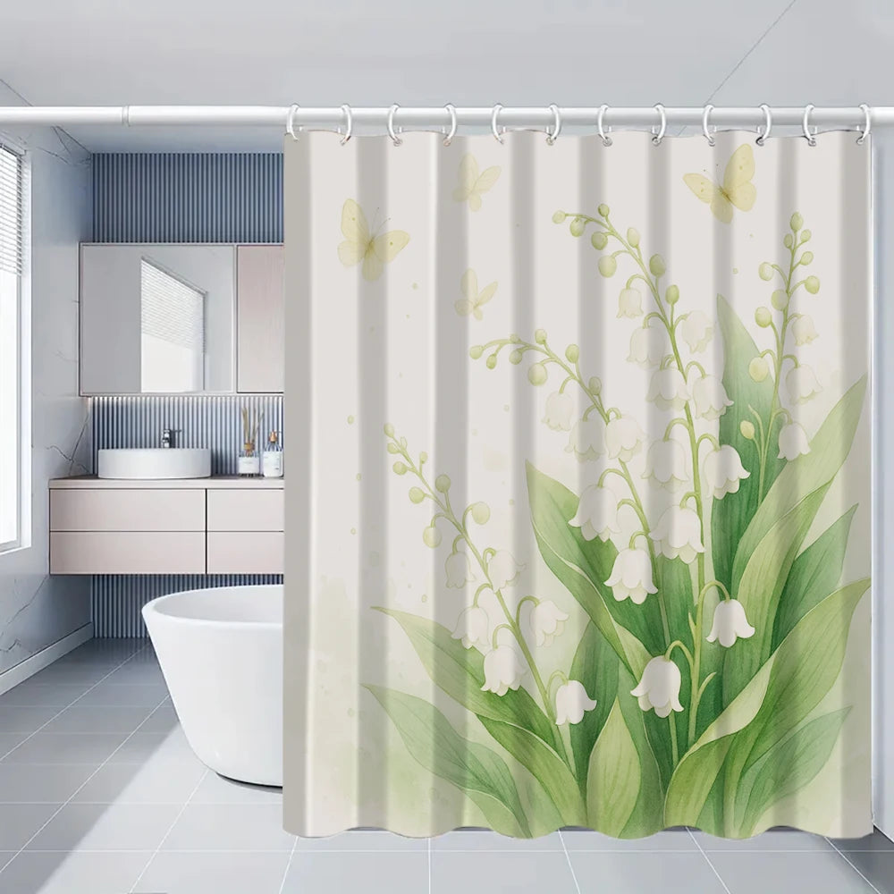 A shower curtain featuring a watercolor floral pattern of white and light green flowers on a pale background.