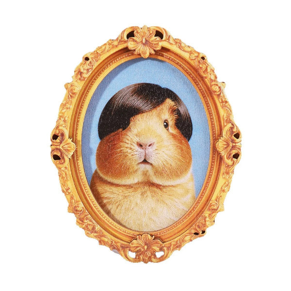 A painting of a brown and black goat framed in ornate gold, used as a retro framed art magnet.