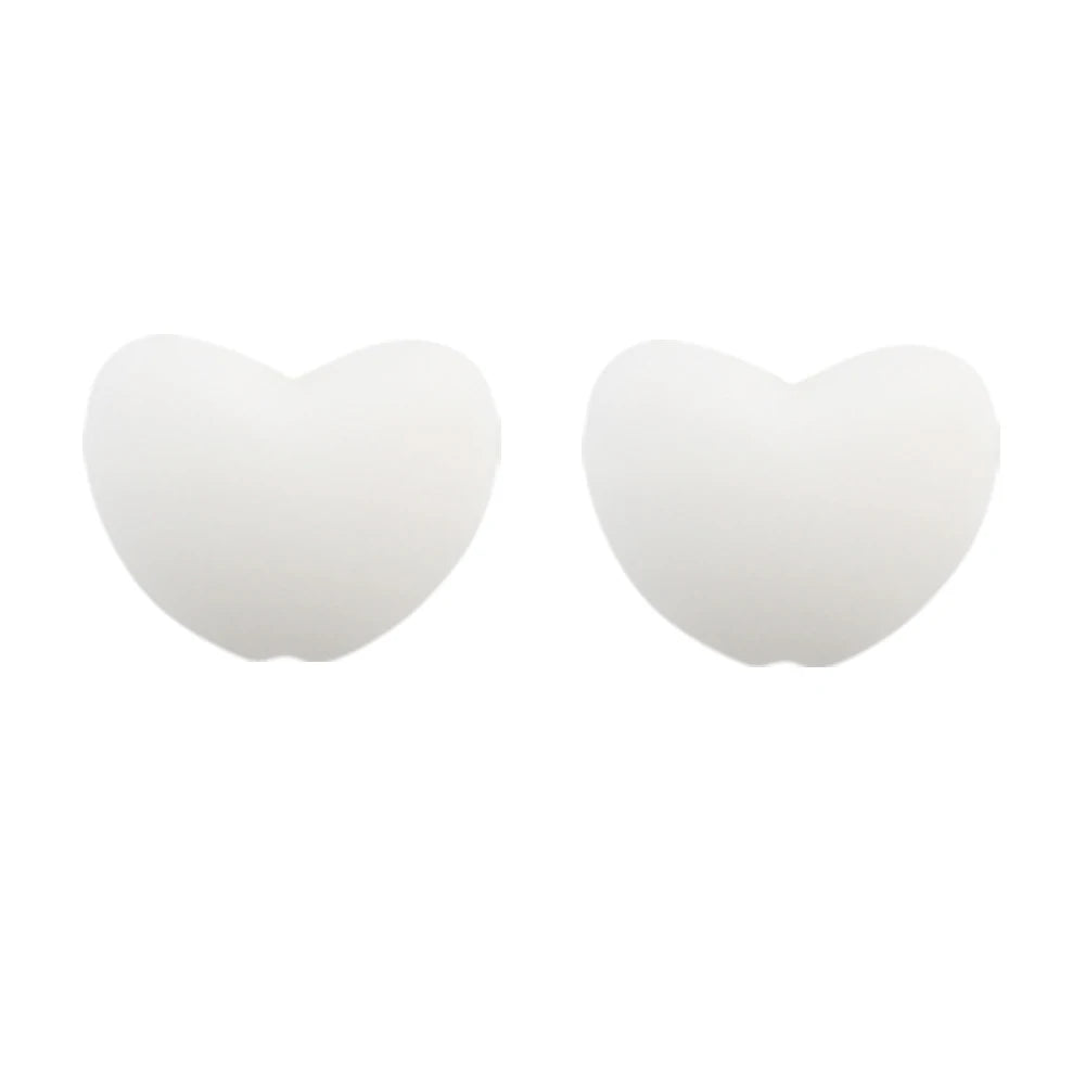 A pair of white silicone heart charm beads for DIY jewelry.