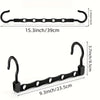 Black plastic clothes hangers with hooks and a bar for closet organization