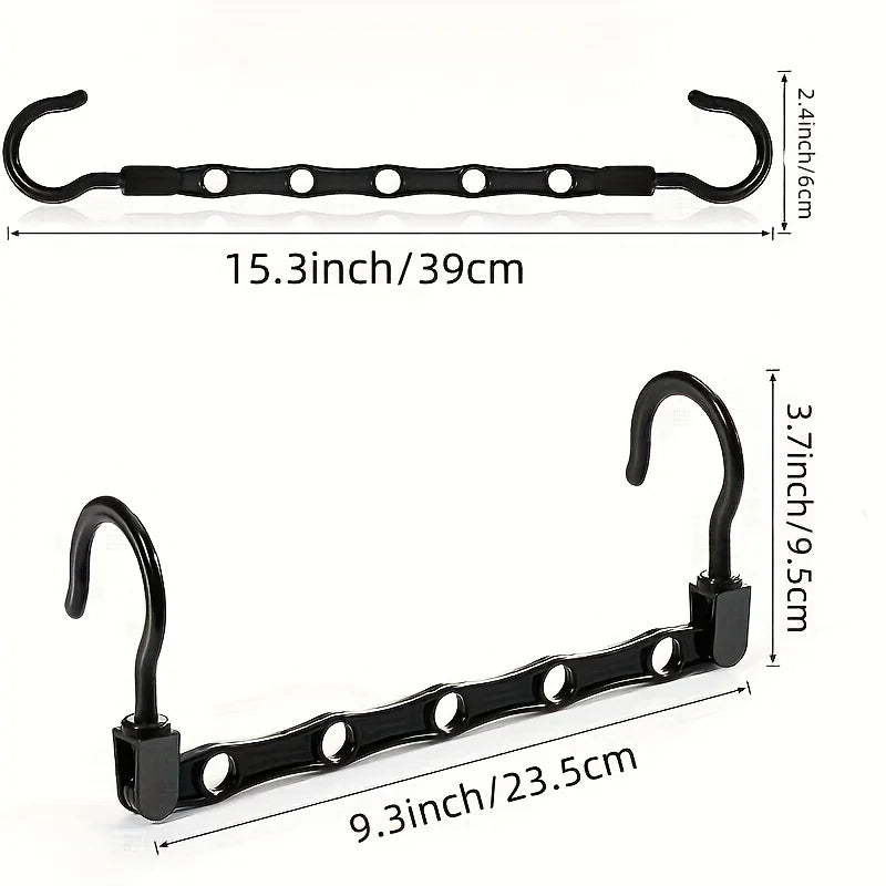 Black plastic clothes hangers with hooks and a bar for closet organization