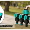A black watering hose connection water line splitter with multiple green and black nozzles.
