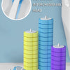 A set of disposable interchangeable toilet brush heads in yellow, blue, and purple colors displayed against a light blue wall