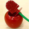 A red cherry-shaped toilet brush set with a bright red bristled brush inside.