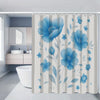 A shower curtain featuring a floral pattern of blue peonies and leaves for bathroom decor.