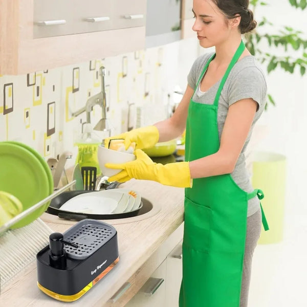 A woman wearing a green apron is dispensing dish soap from a black and yellow hand and dish soap dispenser set.