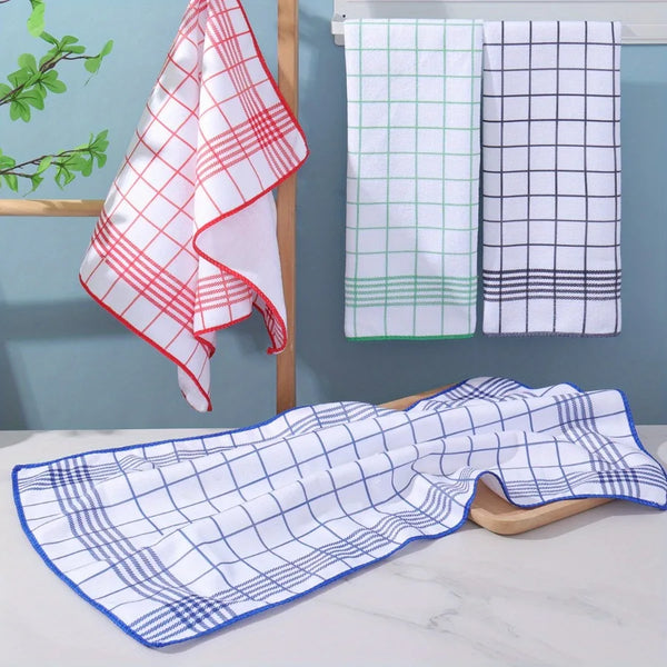A set of six large absorbent white and plaid dish cloths hanging on a wooden rack.