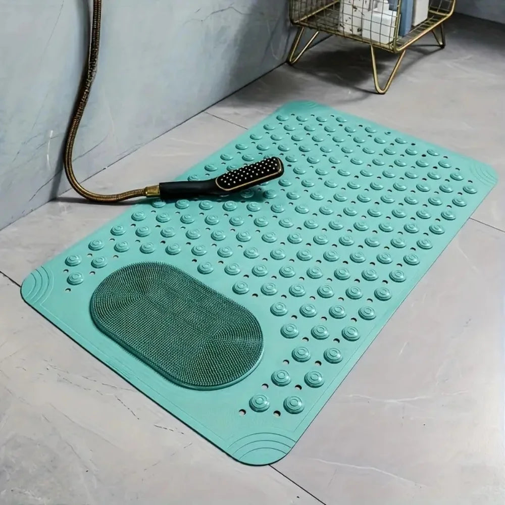 Una alfombra de baño de masaje teal antideslizante con protuberancias texturizadas y una almohadilla de masaje verde, mostrad