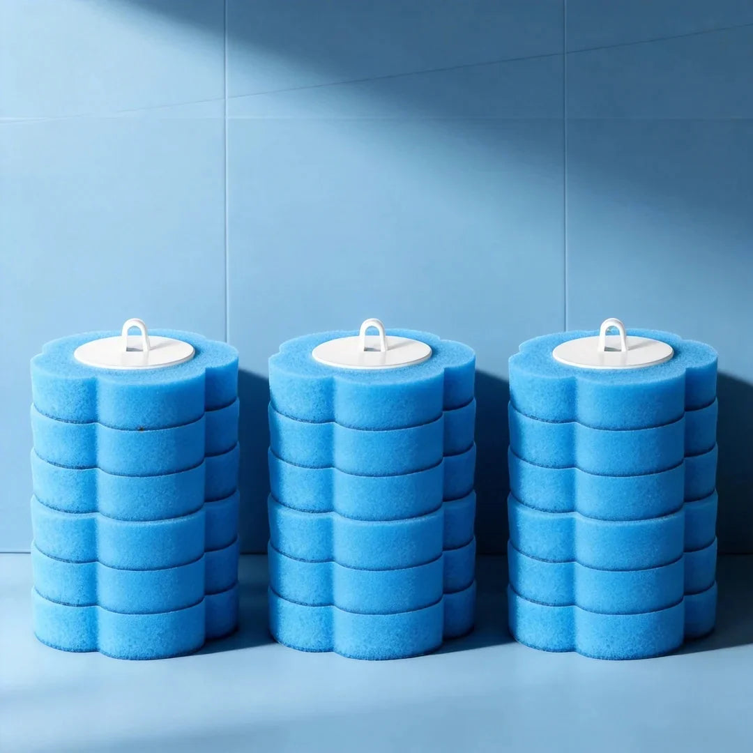 Three stacked blue foam toilet brushes with white handles against a light blue background.