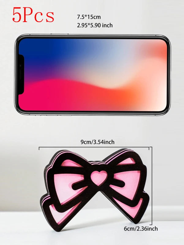 Oreille de chat en nœud rose, décorateur avec dégradé rose et orange sur un écran de smartphone.