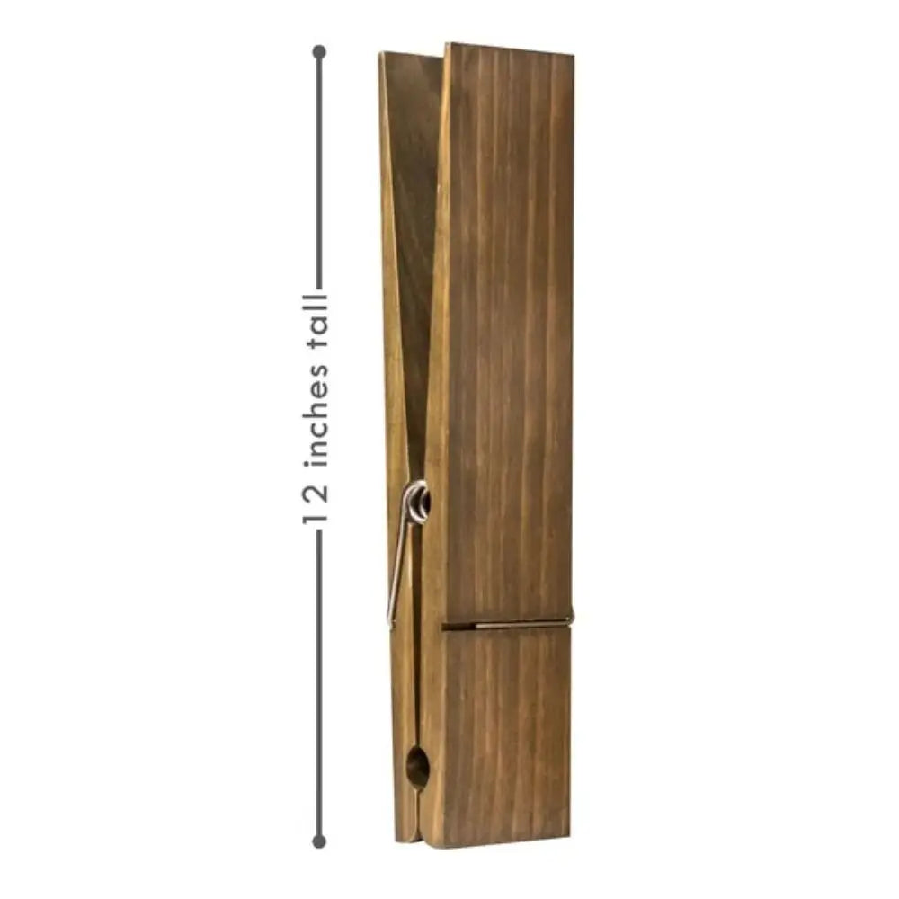 Vertikaler rustikaler Holzhandtuchclip mit Metallhaken und Gleitmechanismus.