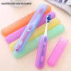 Various colored portable toothbrush storage cases and a single blue toothbrush are displayed on a light background.