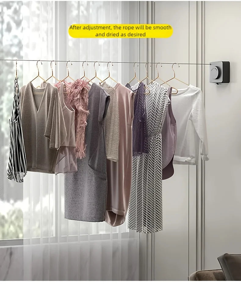 A clothesline with hangers displaying various garments, showing the rope after adjustment and drying.