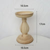 A beige antique wood decorative candlestick holder with a wide bowl and a flared base.