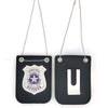 A black leather badge accessory with a silver emblem and a gold chain hanger.