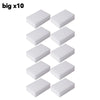 Ten white melamine cleaning sponges or magic erasers arranged in a row.