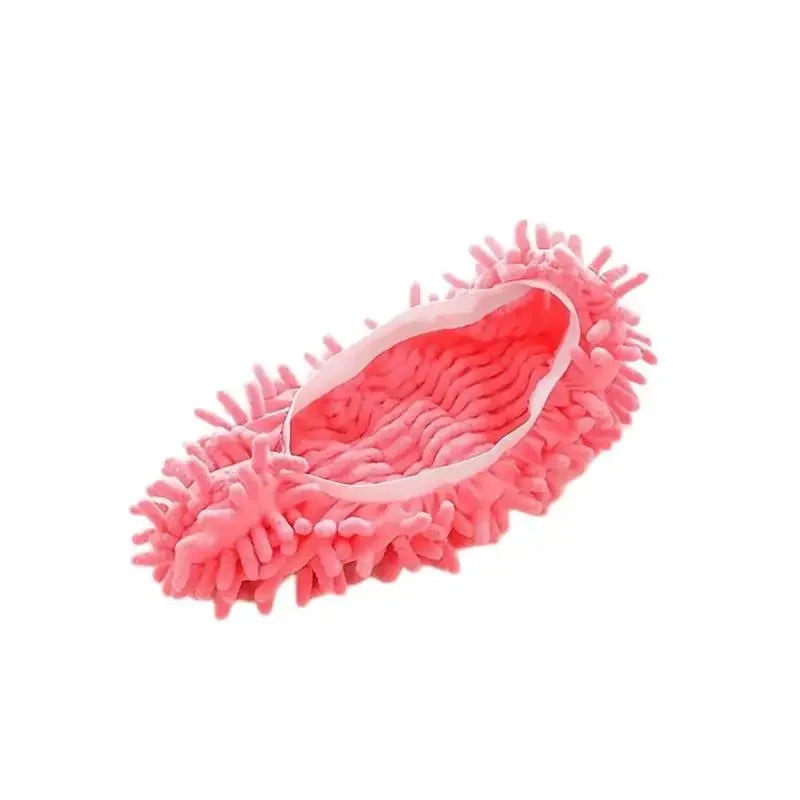 A pink, fibrous dust-absorbing slipper used for floor cleaning.