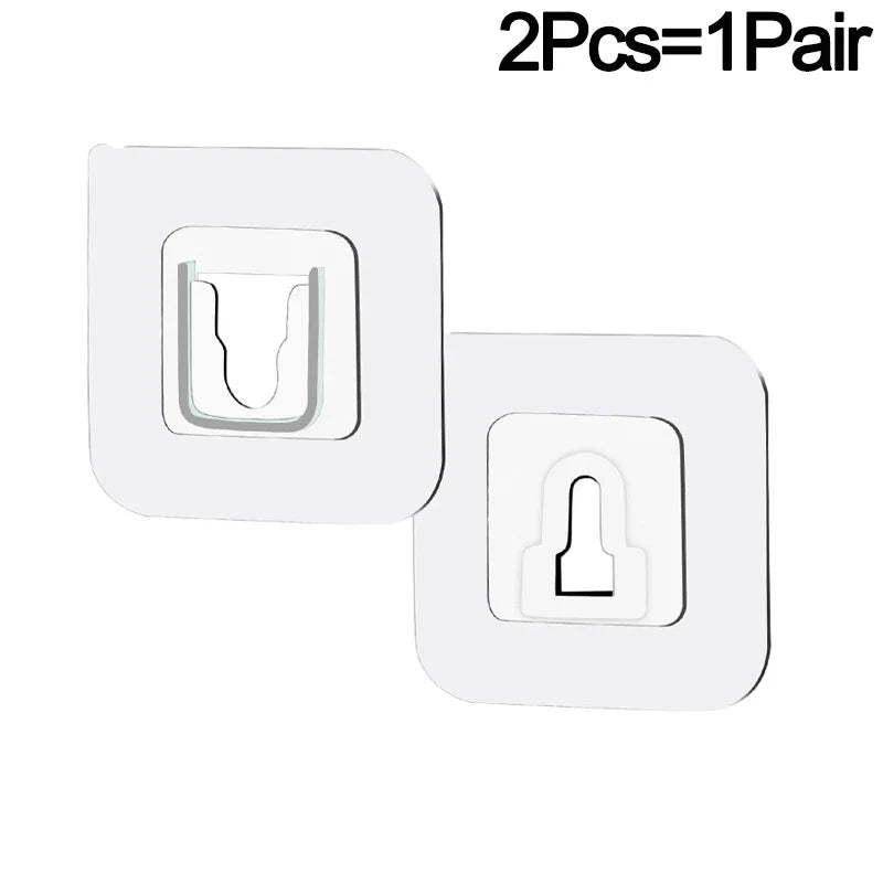 Two white invisible double-sided adhesive wall hooks are shown, packaged as a pair.