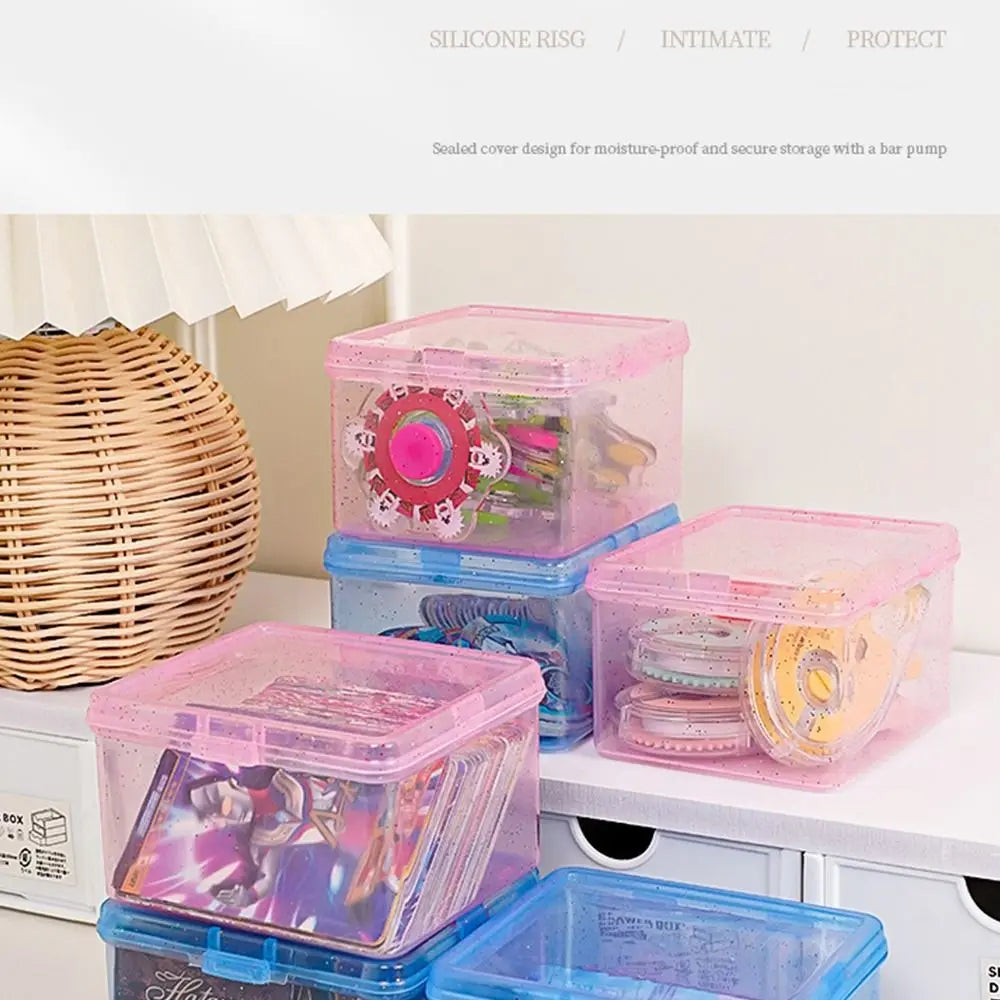 Clear plastic storage boxes for jewelry and small items in pink, purple, and blue colors