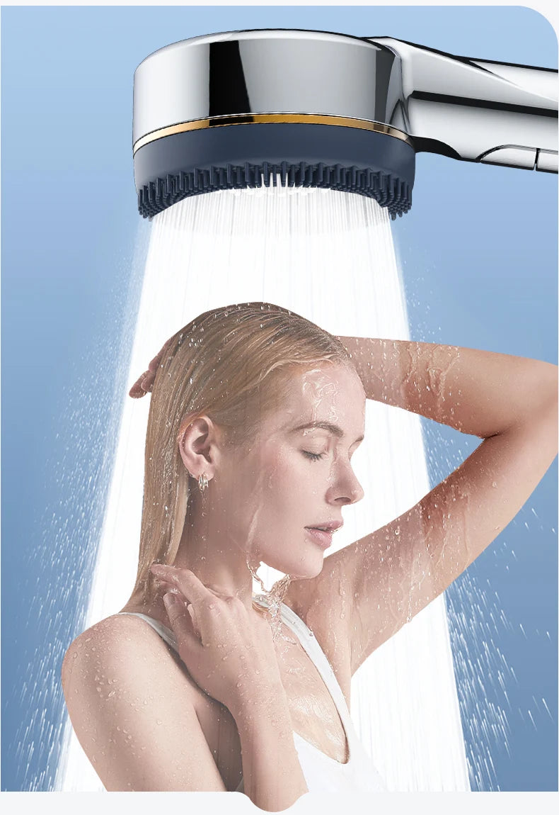 A woman is under a filtered high-pressure shower head, with water spraying onto her face and hair.