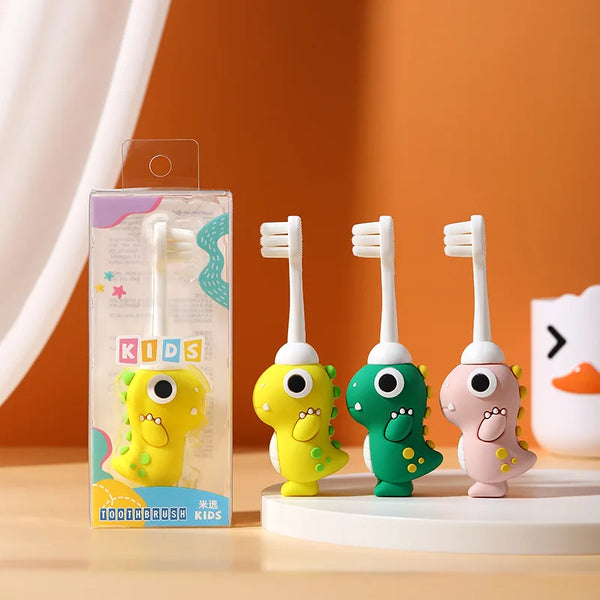 A set of dinosaur cartoon toothbrushes for kids in yellow, green, and pink against an orange background.