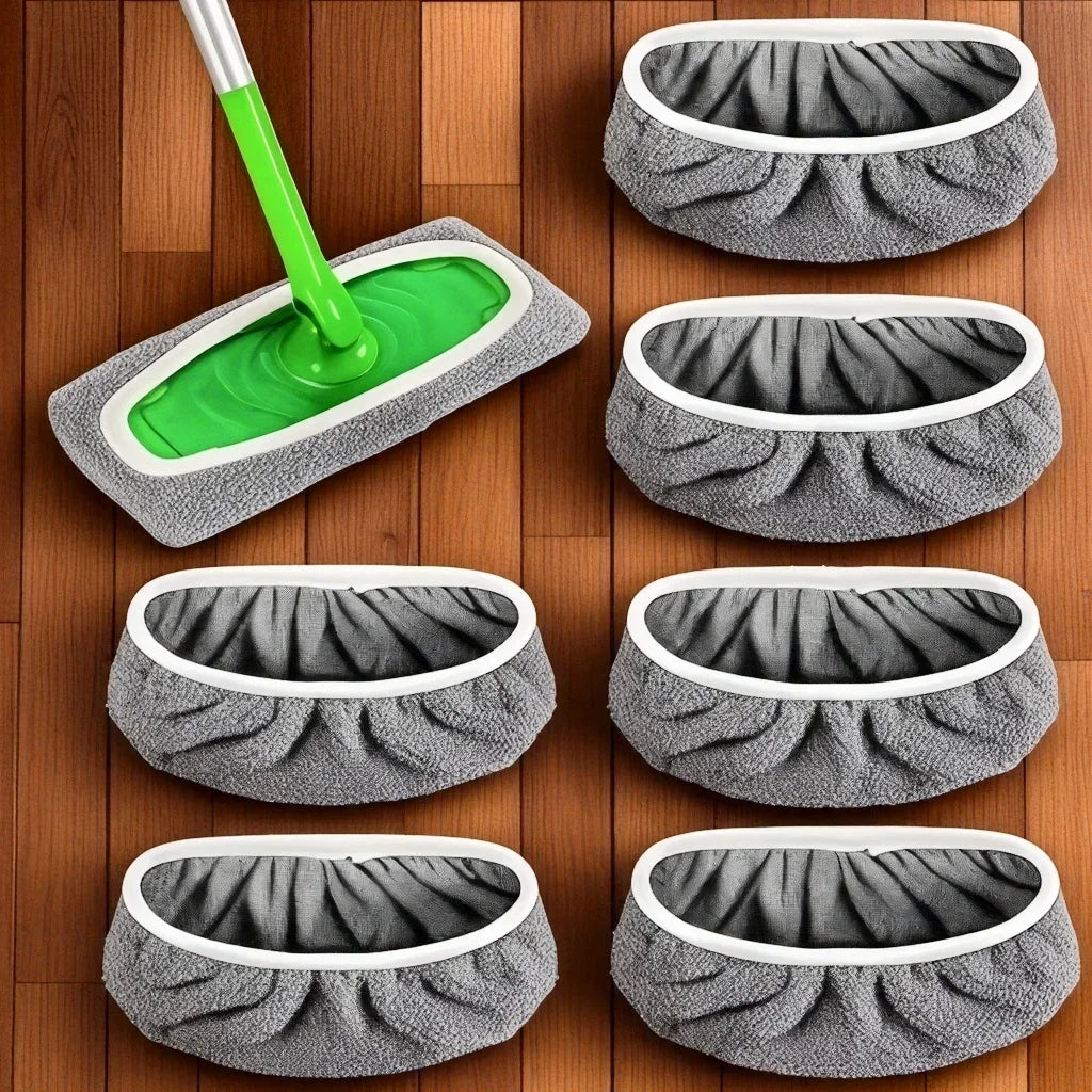 A set of four reusable gray mop pads and one green mop stick are displayed on a wooden surface.