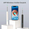 A white and black replacement ear spoon for otoscope cleaning is shown next to a smartphone displaying an ear, highlighting t