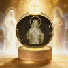 A crystal ball containing a depiction of Jesus with a halo, set on a wooden base.