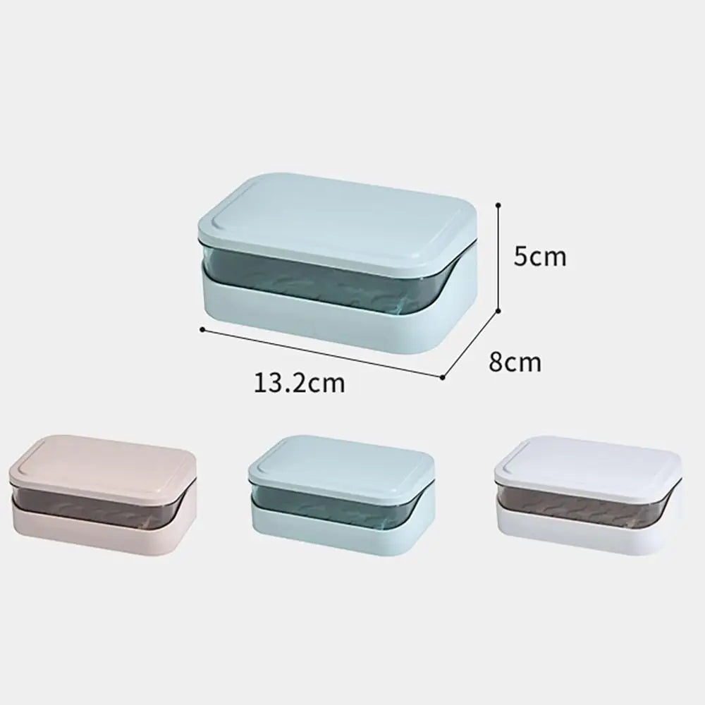 A set of three transparent drainage soap dishes in pink, light blue, and white.