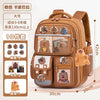 A brown capybara style school backpack for kids featuring various animal patches and compartments.