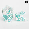 A stack of 50 tulip cupcake liners in white and teal patterns for baking.