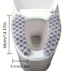 A white toilet seat with a gray and white checkered fabric cushion cover installed.
