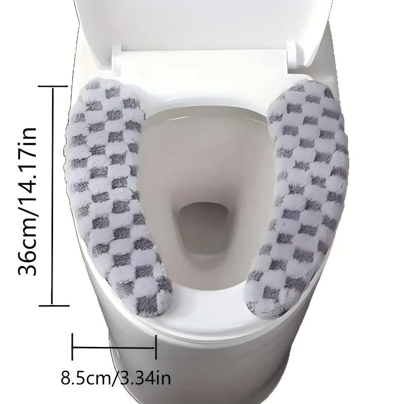 A white toilet seat with a gray and white checkered fabric cushion cover installed.