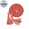 A bright orange and white graduation honor cord with long tassels, coiled into a decorative spiral.