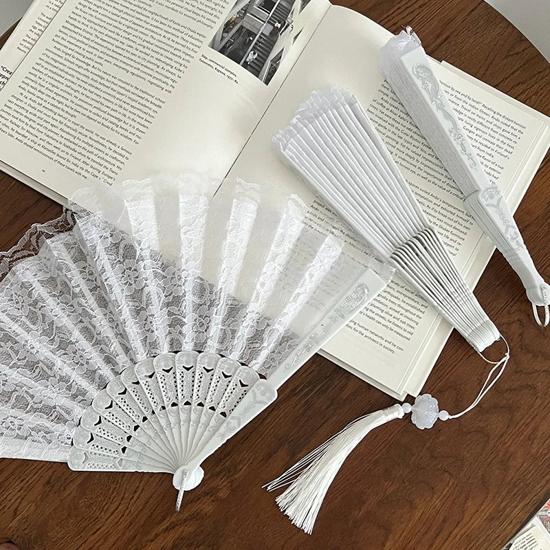 White lace fabric folding hand fan with pleated paper and decorative tassel