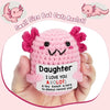 Handmade pink crochet axolotl figurine with a tag that reads I love you daughter