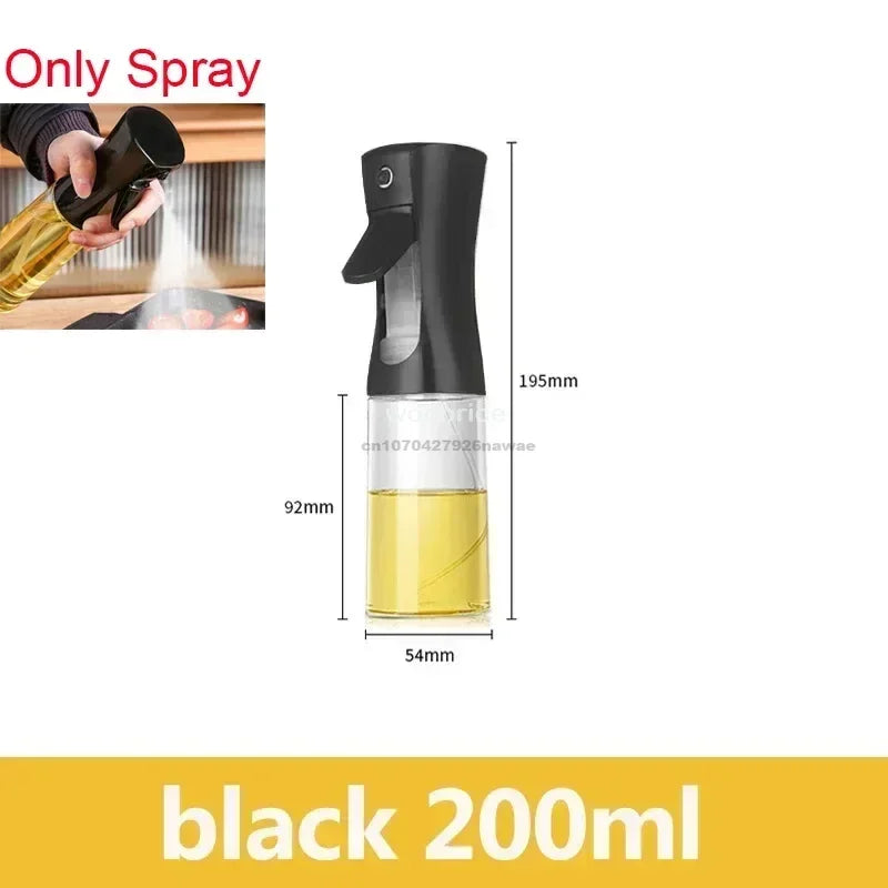 A black oil spray bottle with a pump mechanism and a yellow liquid inside, shown next to a hand applying the spray.