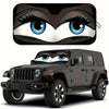 A black Jeep Wrangler with a cartoon owl face design on the windshield.