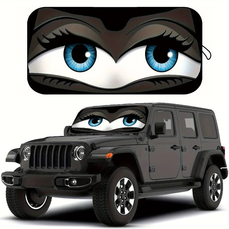 A black Jeep Wrangler with a cartoon owl face design on the windshield.