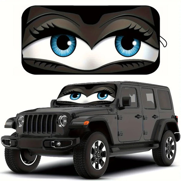 A black Jeep Wrangler with a cartoon owl face design on the windshield.